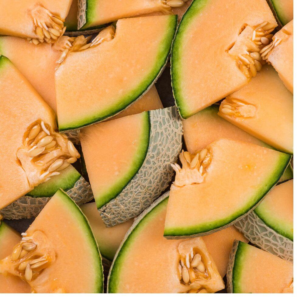 Smart Nutrition for Melon Success Overlapping slices of fresh cantaloupe melon showing vibrant orange flesh, green rind, and visible seeds.